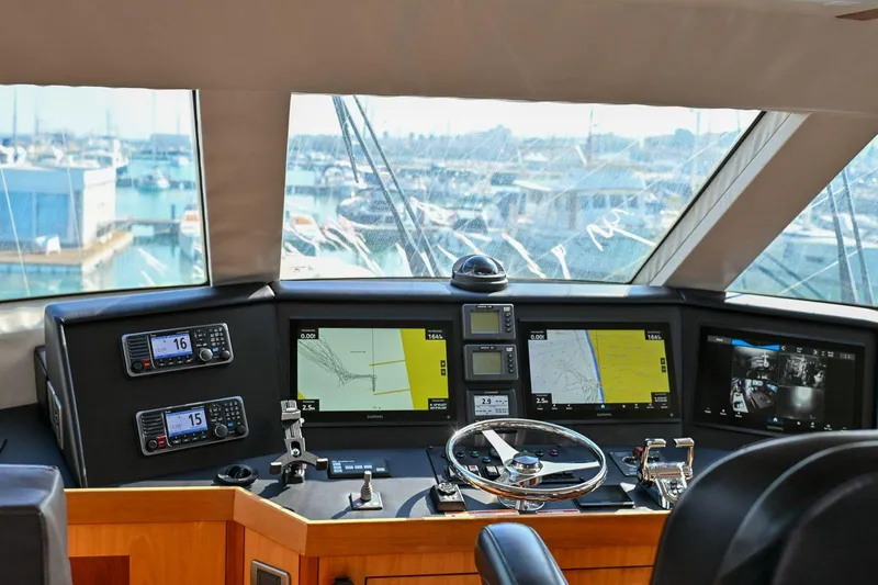 Caraibi Yacht Photos Pics Cockpit of 2013 Hatteras GT63 yacht with advanced navigation systems and controls.