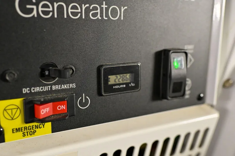 Caraibi Yacht Photos Pics Close-up of a generator control panel on a 2013 Hatteras GT63 yacht.