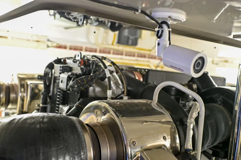 Caraibi Yacht Photos Pics Engine room of 2013 Hatteras GT63 yacht with surveillance camera.