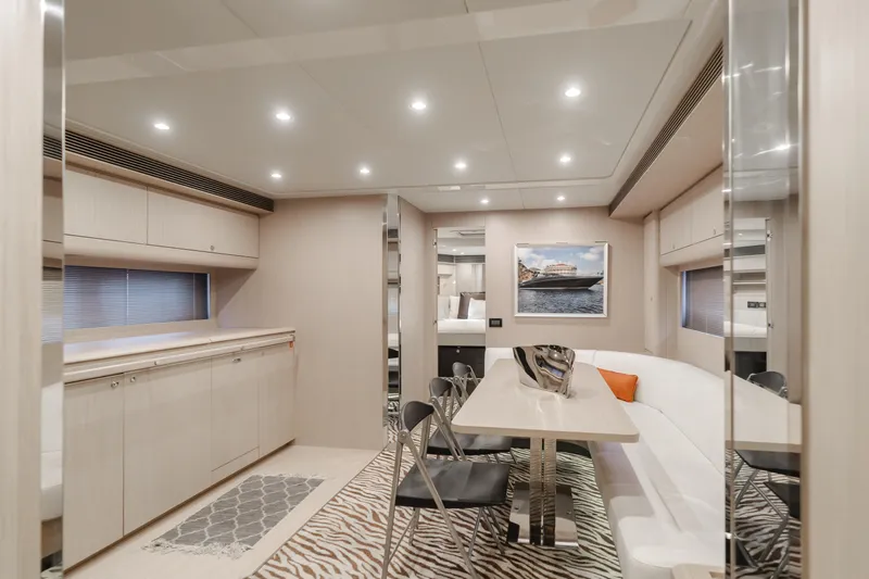 Pergola Yacht Photos Pics Luxurious interior of 2016 Riva 63 Virtus yacht with modern dining area and elegant decor.