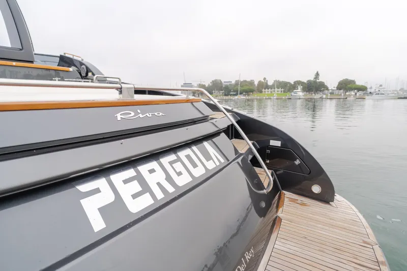 Pergola Yacht Photos Pics Riva 63 Virtus 2016 yacht "Pergola" docked by calm waters.