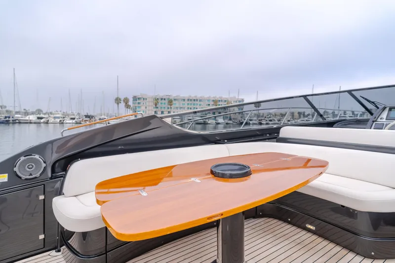 Pergola Yacht Photos Pics Luxurious 2016 Riva 63 Virtus yacht with elegant deck seating and polished wood table.