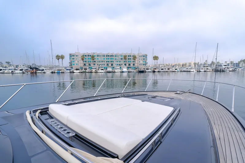 Pergola Yacht Photos Pics 2016 Riva 63 Virtus yacht docked in marina, with waterfront view.