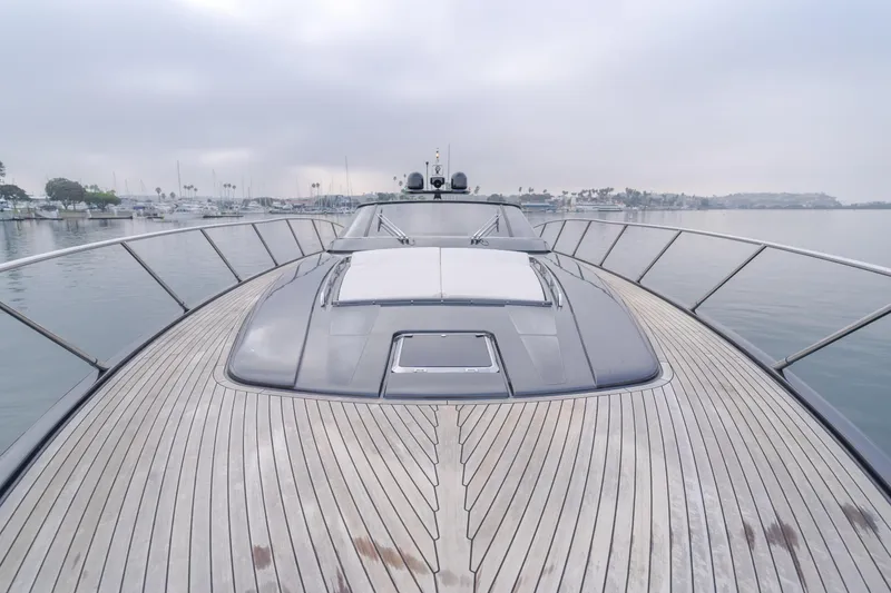 Pergola Yacht Photos Pics 2016 Riva 63 Virtus yacht with sleek wooden deck on calm water.