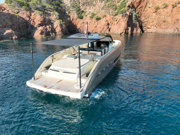  Yacht Photos Pics Luxury Invictus TT460 yacht cruising near rocky coastline, 2020 model.
