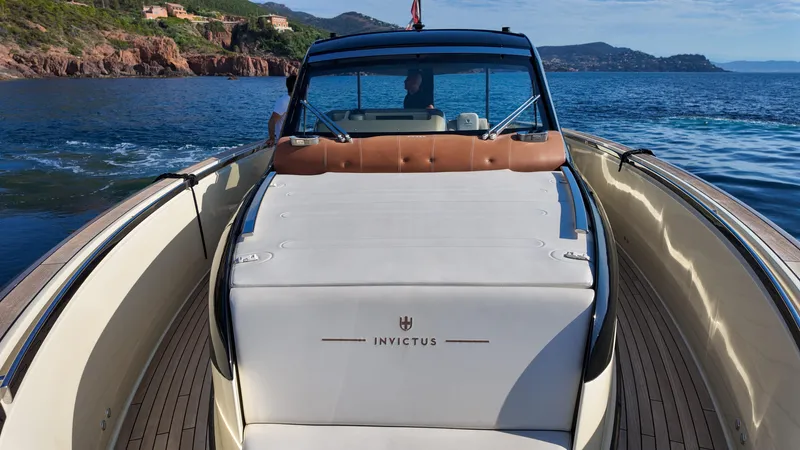  Yacht Photos Pics Invictus TT460 yacht cruising on scenic waters, showcasing luxury design and comfort.