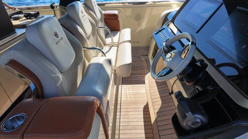  Yacht Photos Pics Luxurious helm of 2020 Invictus TT460 yacht with leather seats and modern controls.