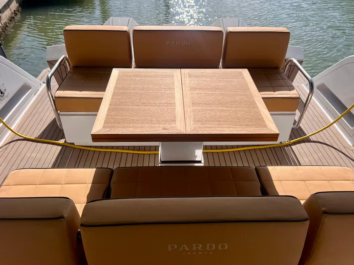  Yacht Photos Pics 2024 Pardo Yachts P38 interior with elegant seating and wooden table on deck.