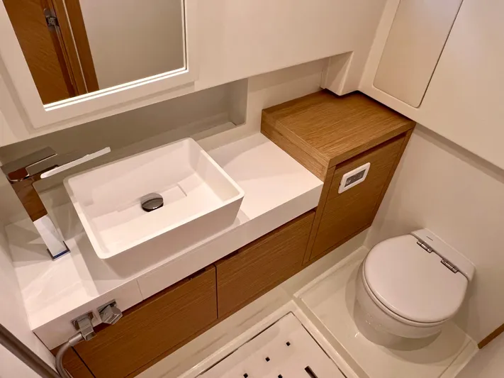  Yacht Photos Pics Luxurious bathroom in 2024 Pardo Yachts P38, featuring modern sink and toilet.