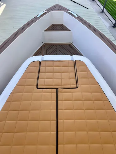  Yacht Photos Pics 2024 Pardo Yachts P38 deck with tan cushioned seating and sleek design.
