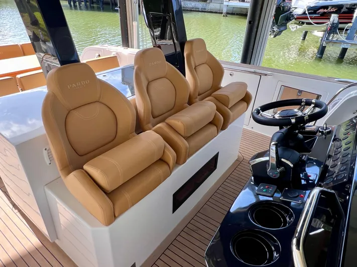  Yacht Photos Pics 2024 Pardo Yachts P38 interior with tan leather seats and modern steering console.