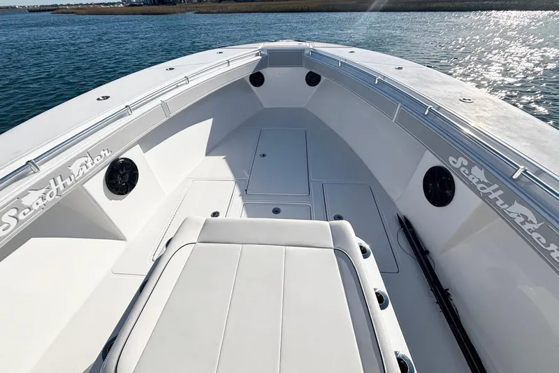  Yacht Photos Pics 2024 SeaHunter 39 Tournament boat deck with seating, on calm water.