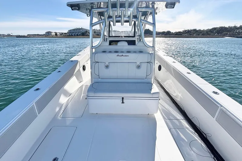  Yacht Photos Pics 2024 SeaHunter 39 Tournament boat on calm water, showcasing sleek design and spacious deck.