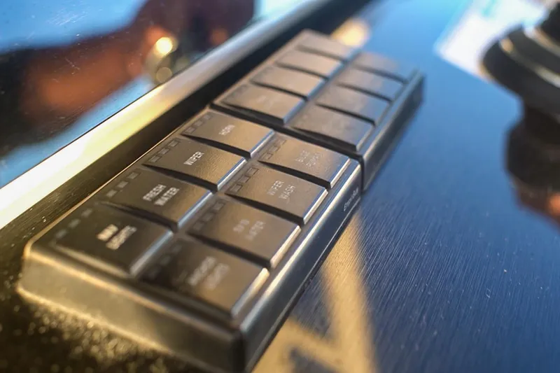  Yacht Photos Pics Control panel of 2022 World Cat 400 CC-X boat with labeled buttons.