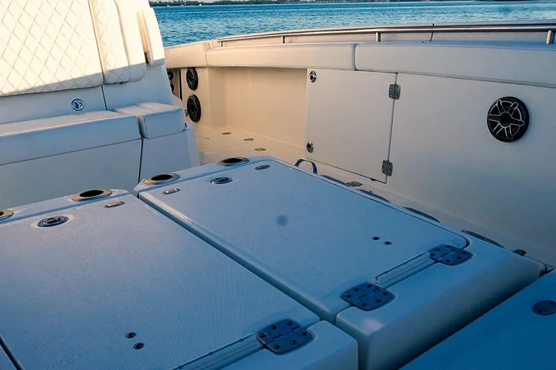  Yacht Photos Pics 2022 World Cat 400 CC-X boat interior with seating and storage compartments.