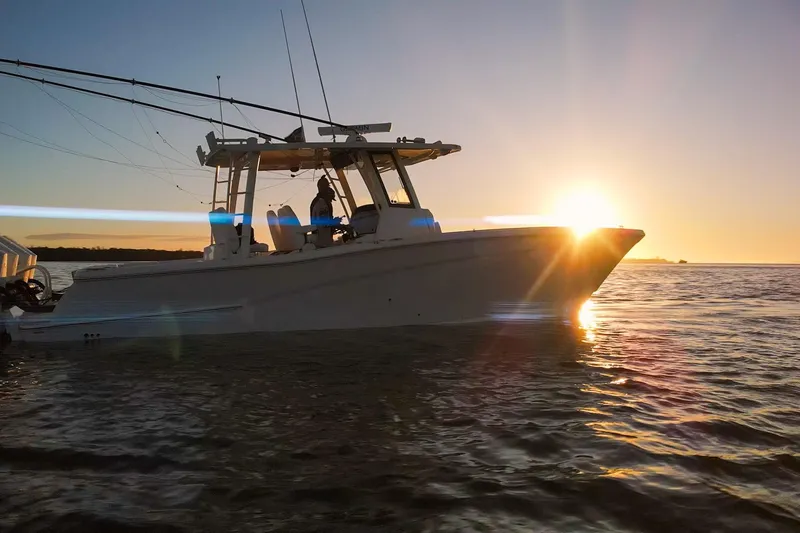  Yacht Photos Pics 2022 World Cat 400 CC-X boat at sunset on the water.