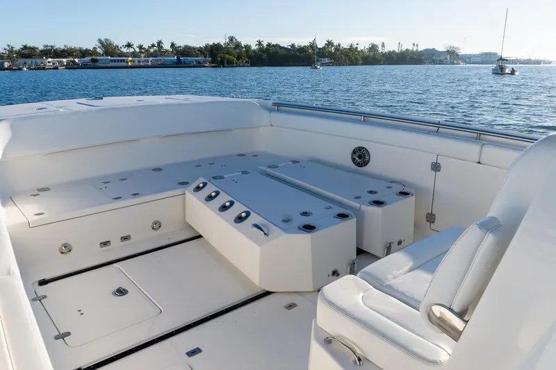  Yacht Photos Pics 2022 World Cat 400 CC-X boat interior with seating and storage, on calm water.