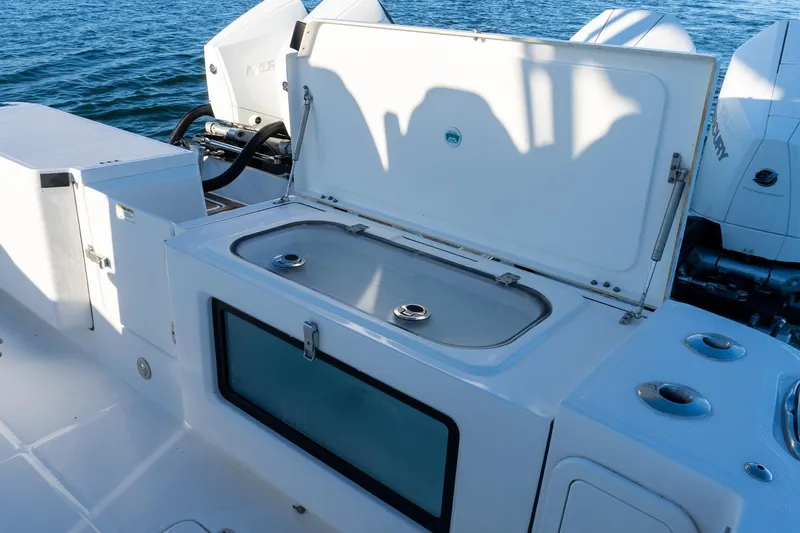  Yacht Photos Pics Open storage compartment on 2022 World Cat 400 CC-X boat, with ocean backdrop.