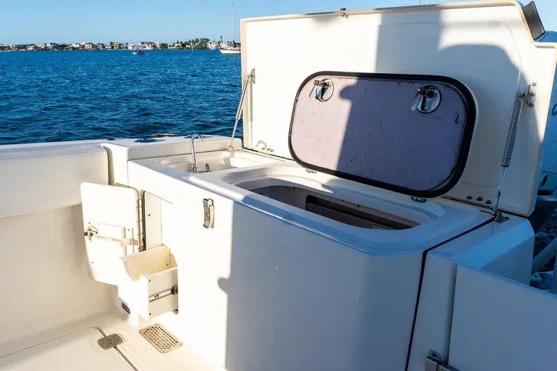  Yacht Photos Pics 2022 World Cat 400 CC-X boat with open storage compartment on deck.