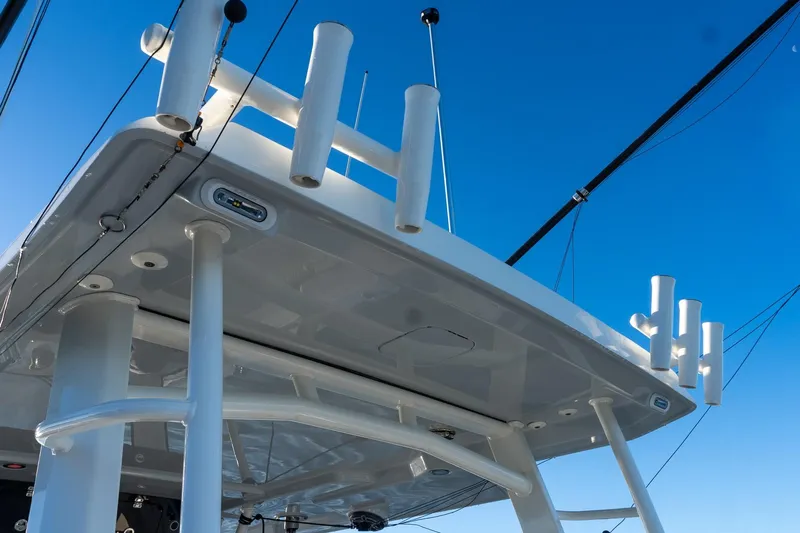  Yacht Photos Pics 2022 World Cat 400 CC-X boat roof with rod holders against clear blue sky.