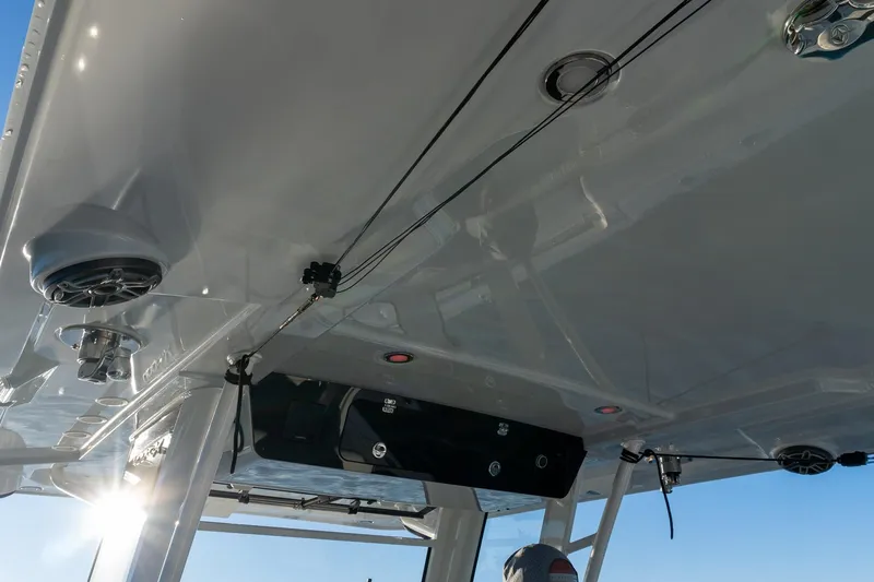  Yacht Photos Pics 2022 World Cat 400 CC-X boat interior with speakers and fishing rod holders.