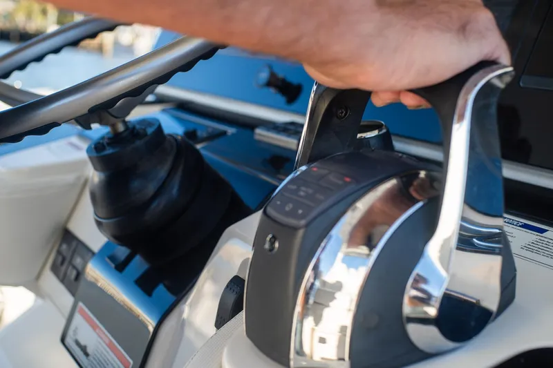  Yacht Photos Pics Close-up of 2022 World Cat 400 CC-X boat controls and steering wheel.