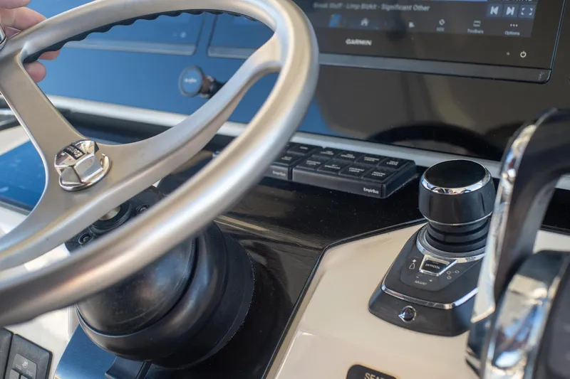  Yacht Photos Pics Steering wheel and controls of 2022 World Cat 400 CC-X boat cockpit.