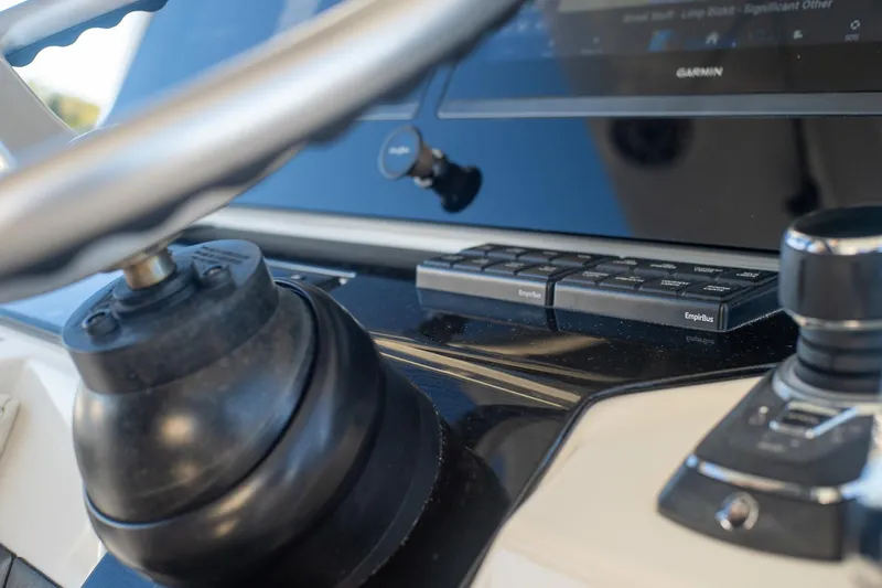  Yacht Photos Pics Close-up of 2022 World Cat 400 CC-X boat dashboard with steering wheel and controls.