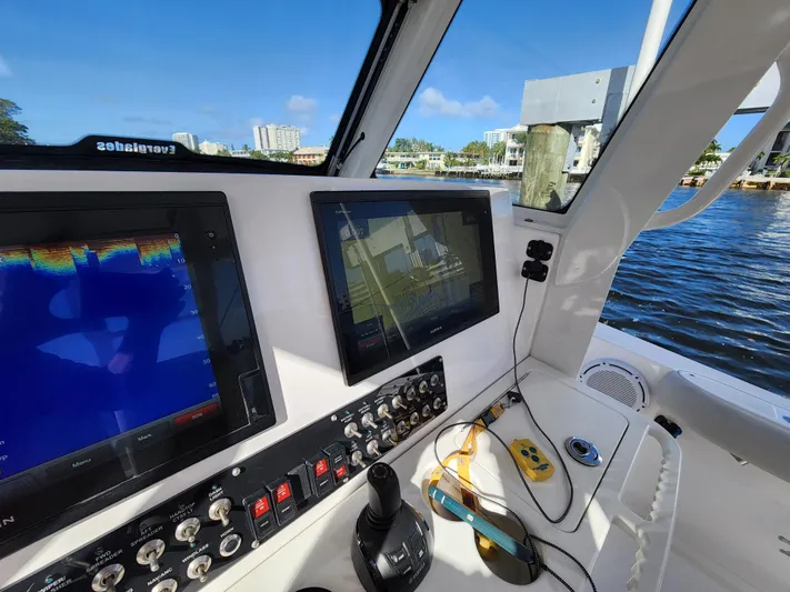  Yacht Photos Pics 2019 Everglades 365 boat dashboard with navigation screens and controls.