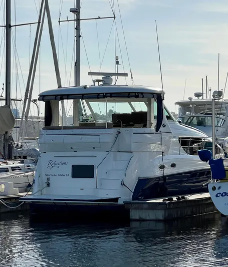 Reflections Yacht Photos Pics 2005 Sea Ray 390 Motor Yacht docked at marina, surrounded by sailboats.