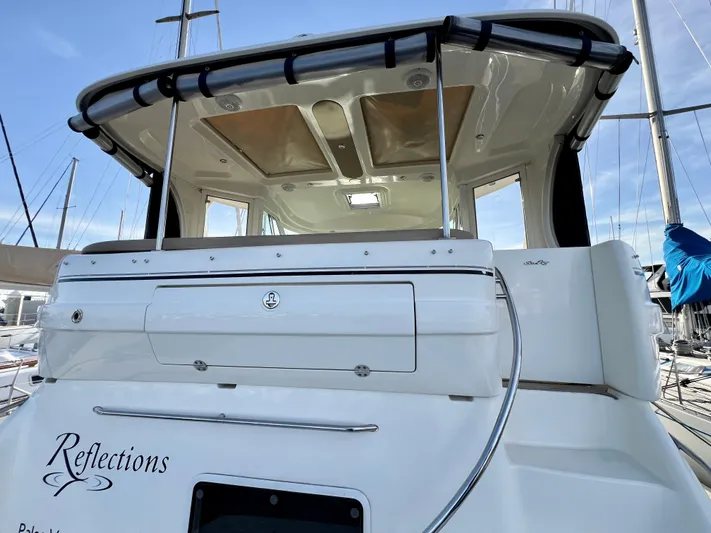 Reflections Yacht Photos Pics 2005 Sea Ray 390 Motor Yacht, rear view, docked, with "Reflections" name visible.