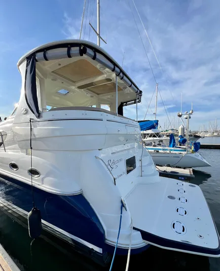 Reflections Yacht Photos Pics 2005 Sea Ray 390 Motor Yacht docked at marina under clear blue sky.