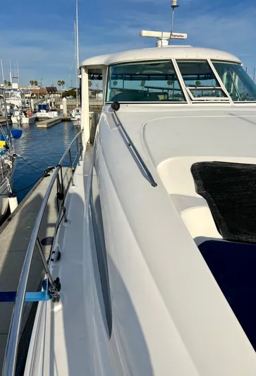 Reflections Yacht Photos Pics 2005 Sea Ray 390 Motor Yacht docked at marina, side view.