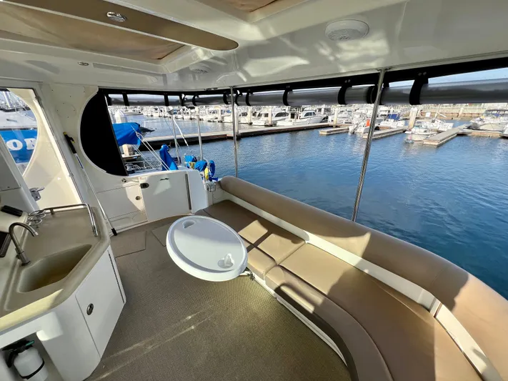 Reflections Yacht Photos Pics 2005 Sea Ray 390 Motor Yacht interior with seating and marina view.