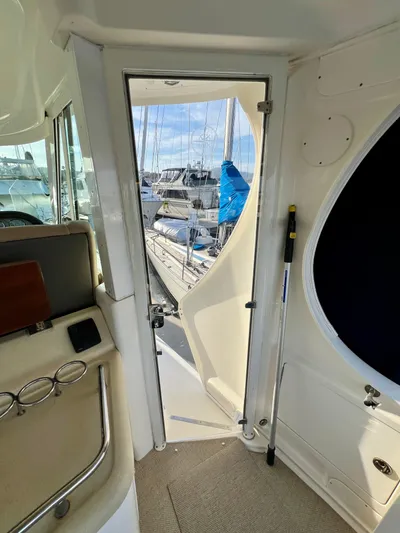 Reflections Yacht Photos Pics Interior view of 2005 Sea Ray 390 Motor Yacht with open door to marina.