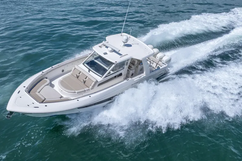  Yacht Photos Pics 2018 Boston Whaler 420 Outrage cruising on open water, showcasing sleek design and power.
