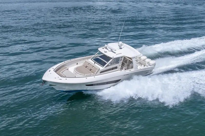  Yacht Photos Pics 2018 Boston Whaler 420 Outrage cruising on open water, showcasing sleek design and performance.