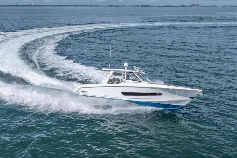  Yacht Photos Pics 2018 Boston Whaler 420 Outrage cruising swiftly on open water.