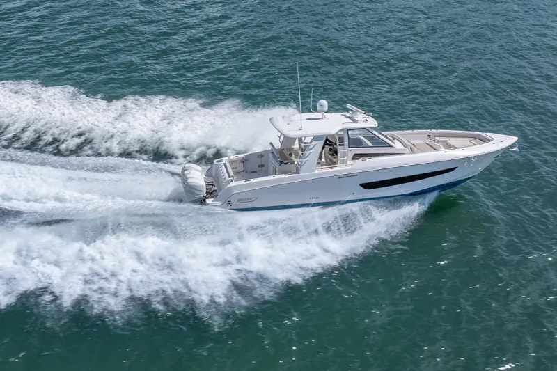  Yacht Photos Pics 2018 Boston Whaler 420 Outrage cruising swiftly on open water.