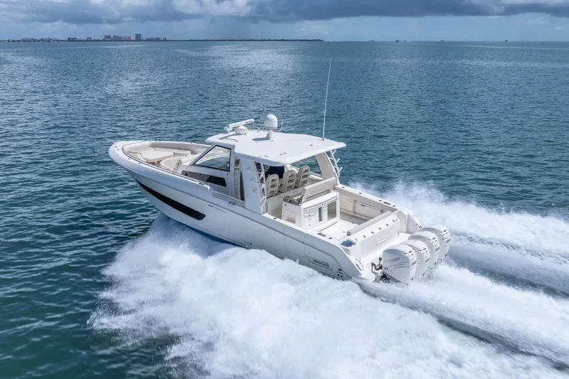 Yacht Photos Pics 2018 Boston Whaler 420 Outrage cruising on open water, showcasing powerful engines and sleek design.