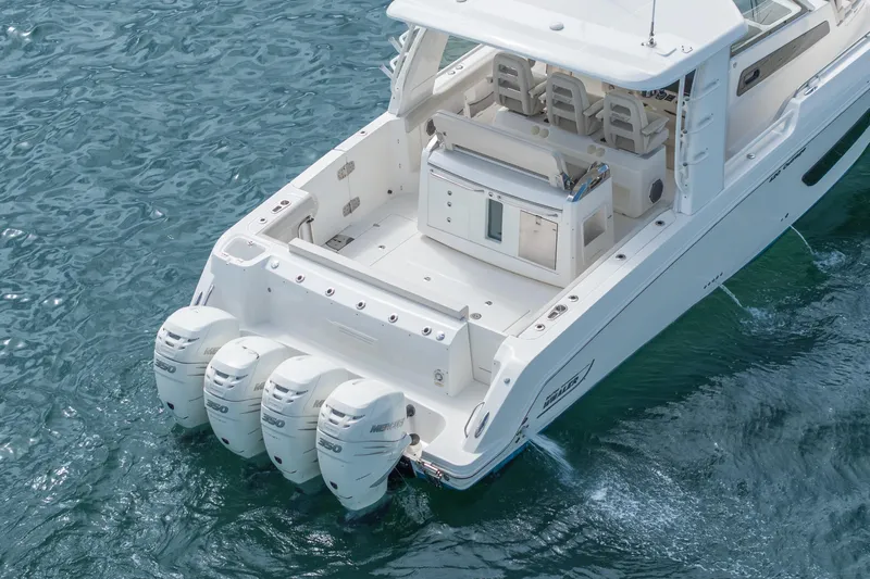  Yacht Photos Pics 2018 Boston Whaler 420 Outrage boat with four powerful outboard engines on water.