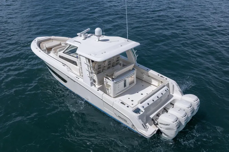  Yacht Photos Pics 2018 Boston Whaler 420 Outrage boat cruising on open water.