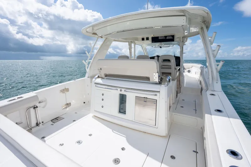  Yacht Photos Pics 2018 Boston Whaler 420 Outrage boat interior on open sea under cloudy sky.