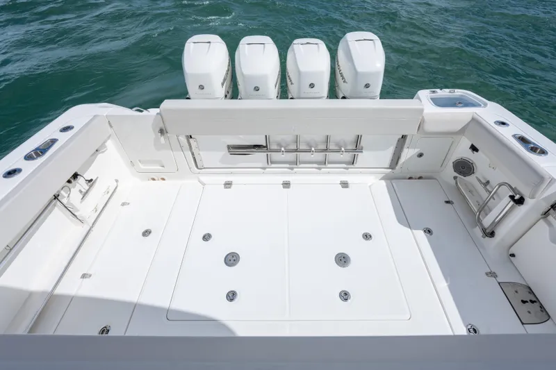  Yacht Photos Pics 2018 Boston Whaler 420 Outrage boat deck with four engines on open water.
