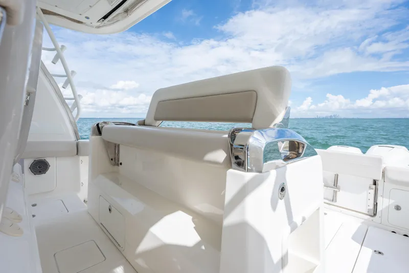  Yacht Photos Pics 2018 Boston Whaler 420 Outrage boat interior with ocean view and clear sky.