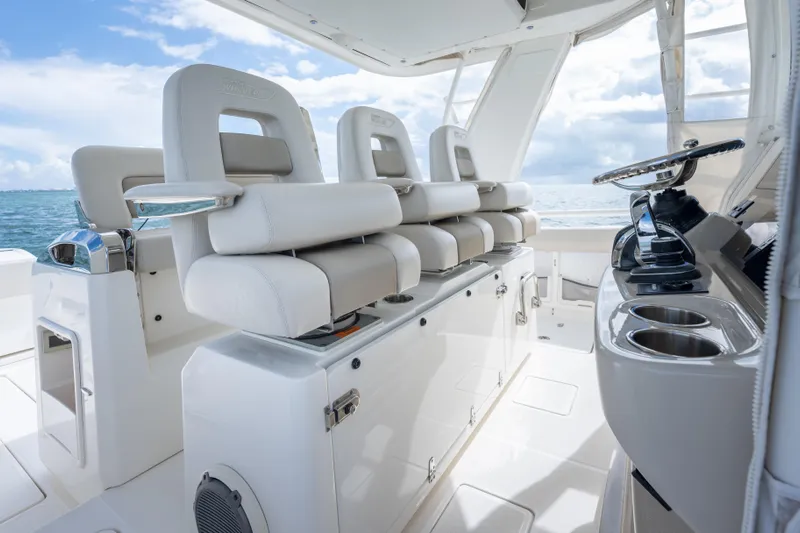  Yacht Photos Pics 2018 Boston Whaler 420 Outrage interior with luxurious seating and modern helm controls.