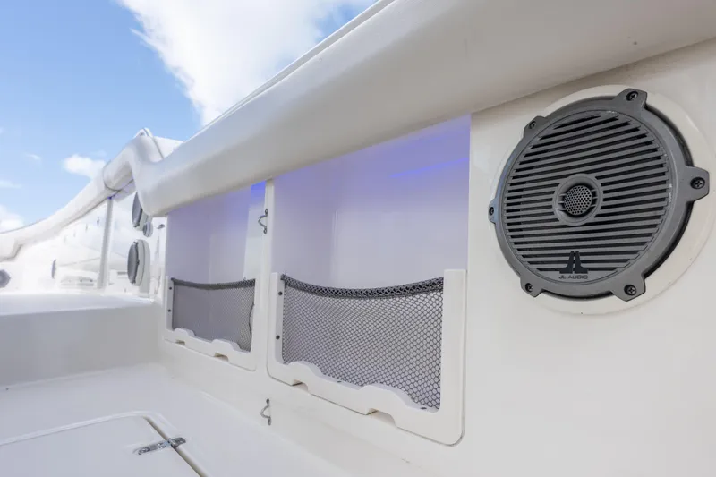  Yacht Photos Pics 2018 Boston Whaler 420 Outrage boat interior with JL Audio speaker and storage nets.