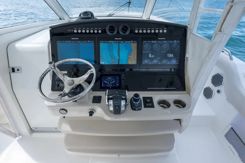  Yacht Photos Pics 2018 Boston Whaler 420 Outrage helm with advanced navigation displays and controls.