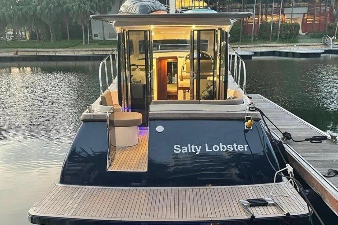 2024 Erman Lobster 34 yacht "Salty Lobster" docked at marina, evening view.