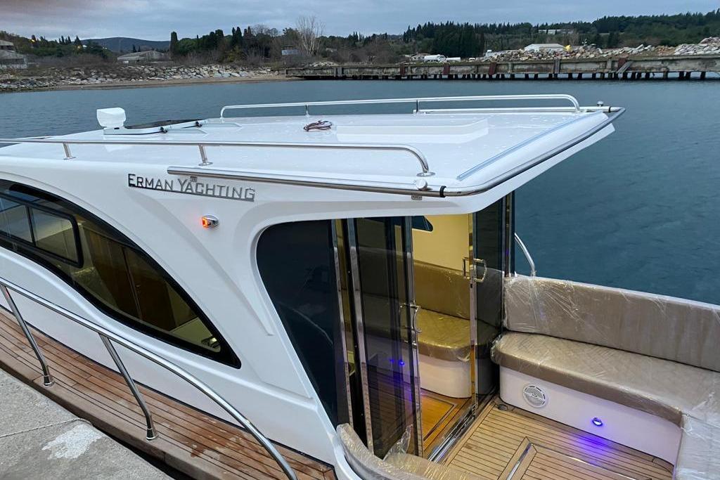 2024 Erman Lobster 34 yacht docked by the water, showcasing sleek design and modern features.